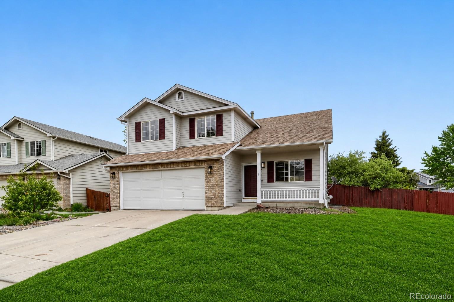 13400 Raritan Street Denver, CO 80234 - Photo 2 of 32 a front view of house with yard and green space