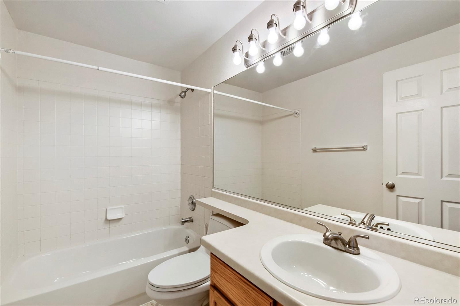 13400 Raritan Street Denver, CO 80234 - Photo 29 of 32 a bathroom with a sink toilet and shower
