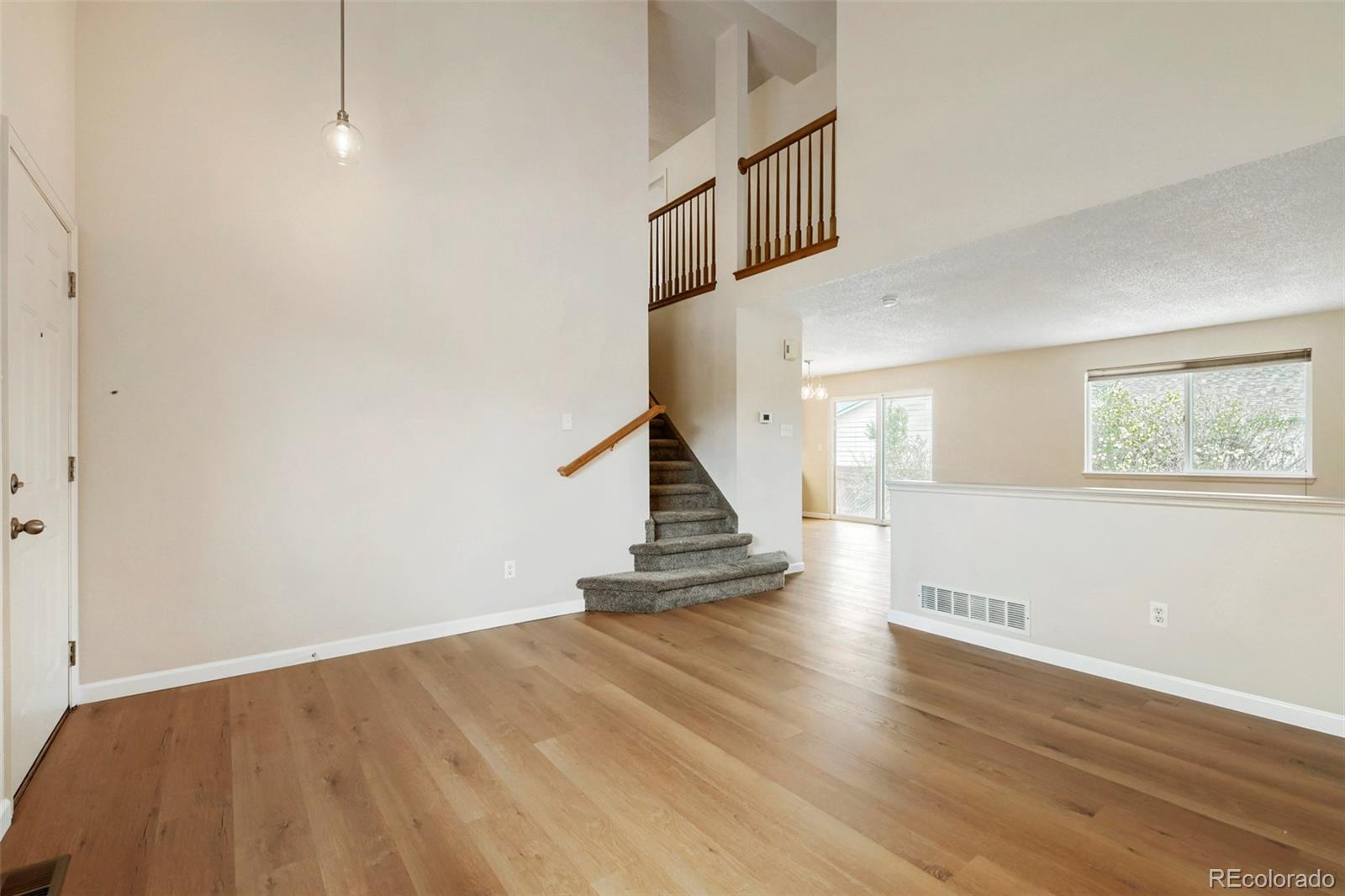 13400 Raritan Street Denver, CO 80234 - Photo 8 of 32 a view of entryway with wooden floor
