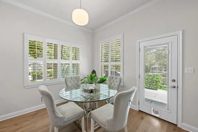 a view of a dining room with furniture window and wooden floor