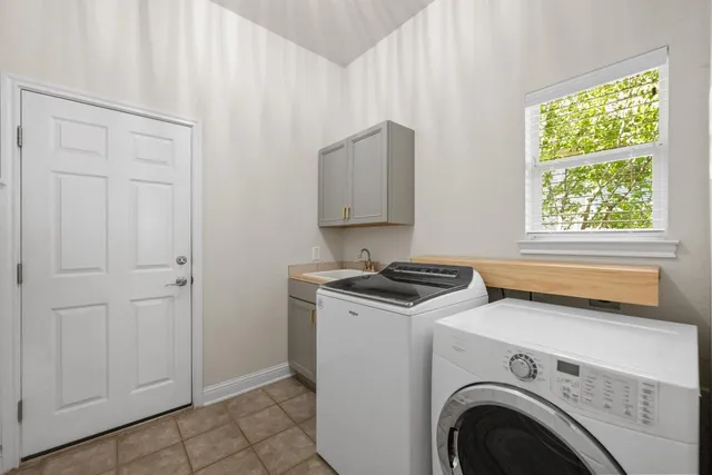 a view of a kitchen with washer and dryer