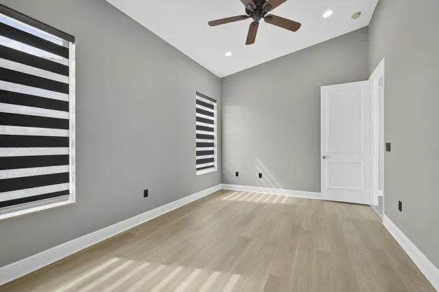 a front view of house with yard and swimming pool