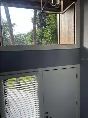 a view of a room that has a large window