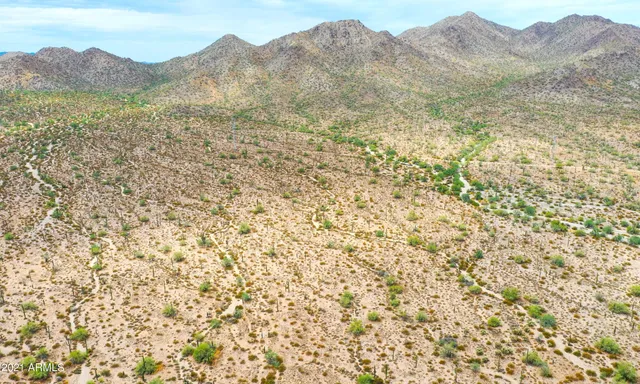 a view of a mountain with a mountain in the background