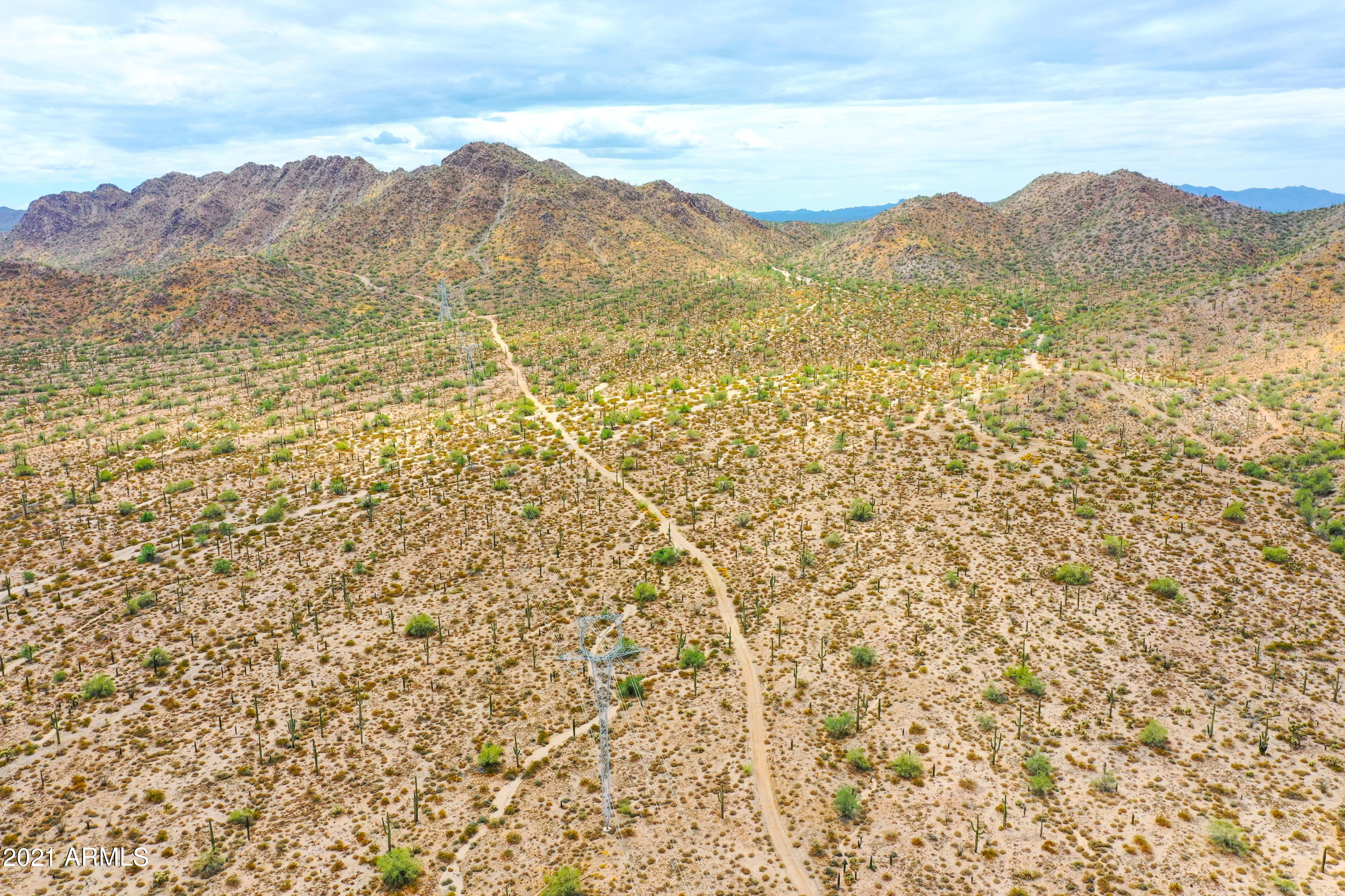 54214 West Whirly Bird Road, Unit 32 Maricopa, AZ 85139 - Photo 23 of 25 a view of a mountain with a mountain in the background
