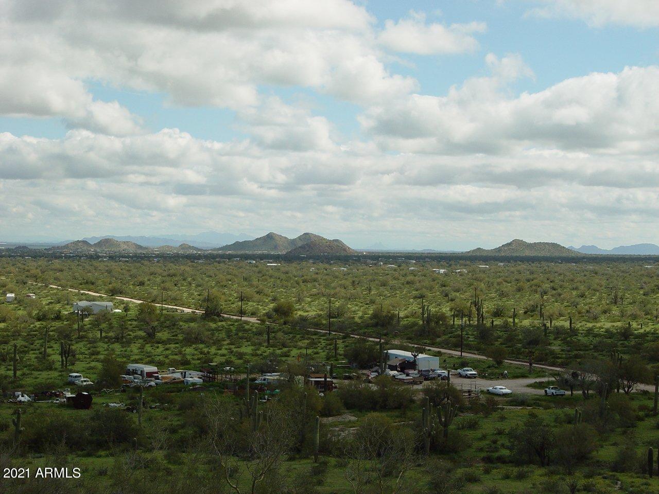 54214 West Whirly Bird Road, Unit 32 Maricopa, AZ 85139 - Photo 6 of 25 a view of lake and mountain