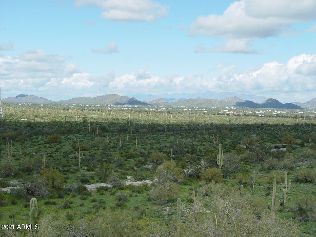 54214 West Whirly Bird Road, Unit 32 Maricopa, AZ 85139 - Photo 9 of 25 a view of a city with lots of green space