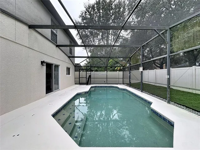 a view of a yard with large trees