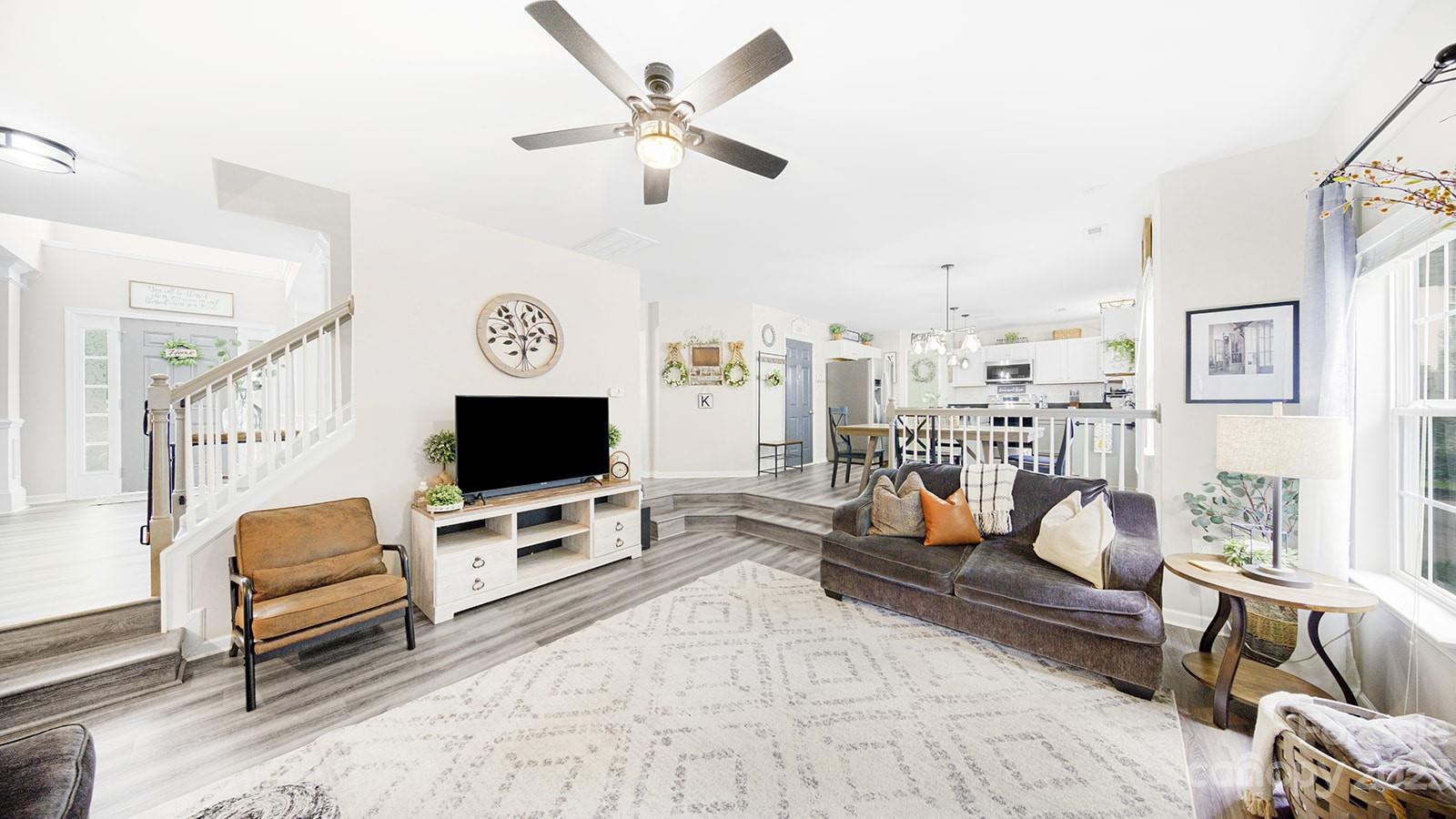 5207 Sunriver Road Gastonia, NC 28054 - Photo 18 of 46 a living room with furniture and a flat screen tv