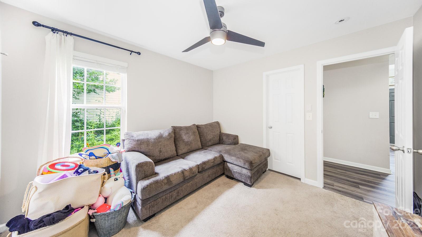 5207 Sunriver Road Gastonia, NC 28054 - Photo 29 of 46 a living room with furniture and a window