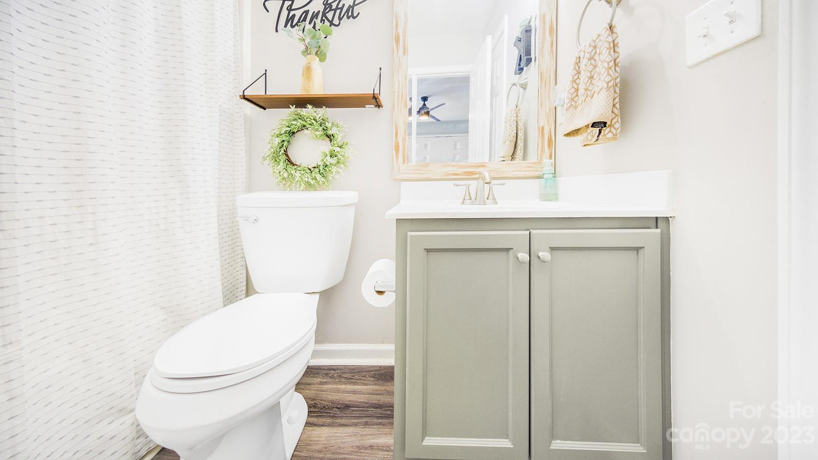 5207 Sunriver Road Gastonia, NC 28054 - Photo 31 of 46 a white toilet sitting next to a bathroom sink