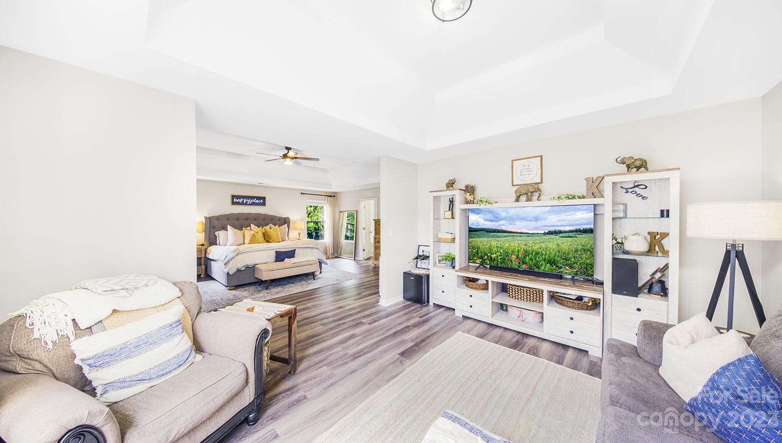 5207 Sunriver Road Gastonia, NC 28054 - Photo 36 of 46 a living room with furniture and a flat screen tv