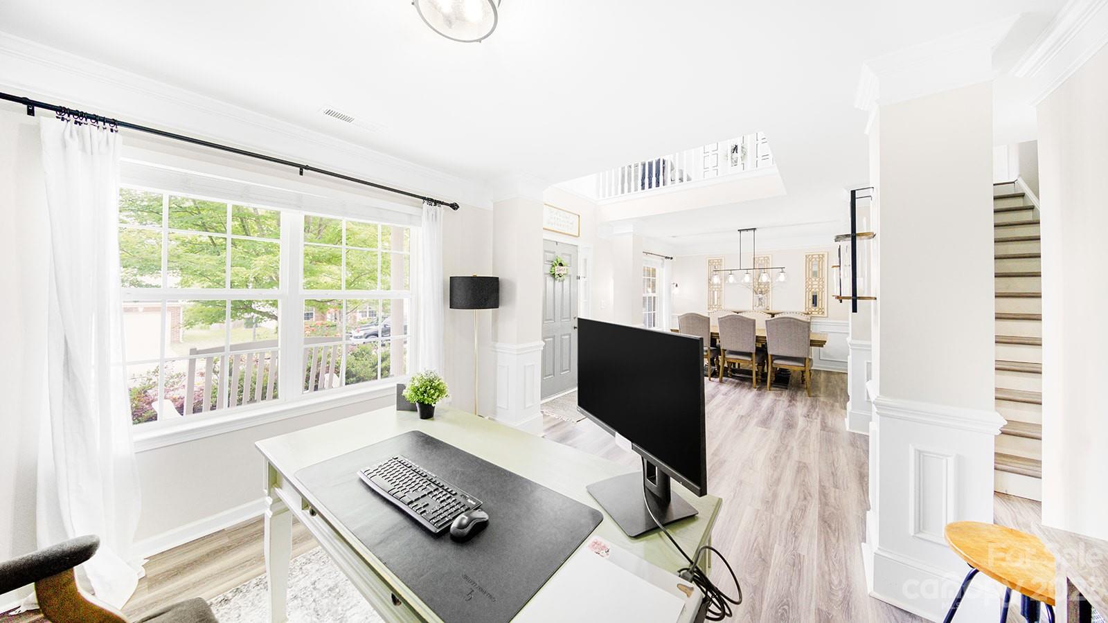 5207 Sunriver Road Gastonia, NC 28054 - Photo 4 of 46 a living room with furniture and a floor to ceiling window