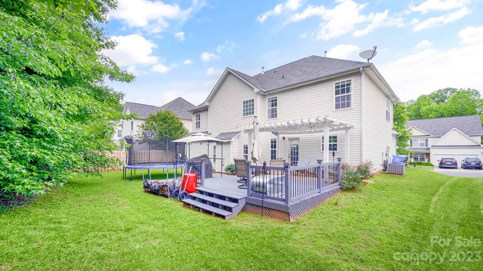 5207 Sunriver Road Gastonia, NC 28054 - Photo 42 of 46 a view of a house with a backyard and a patio
