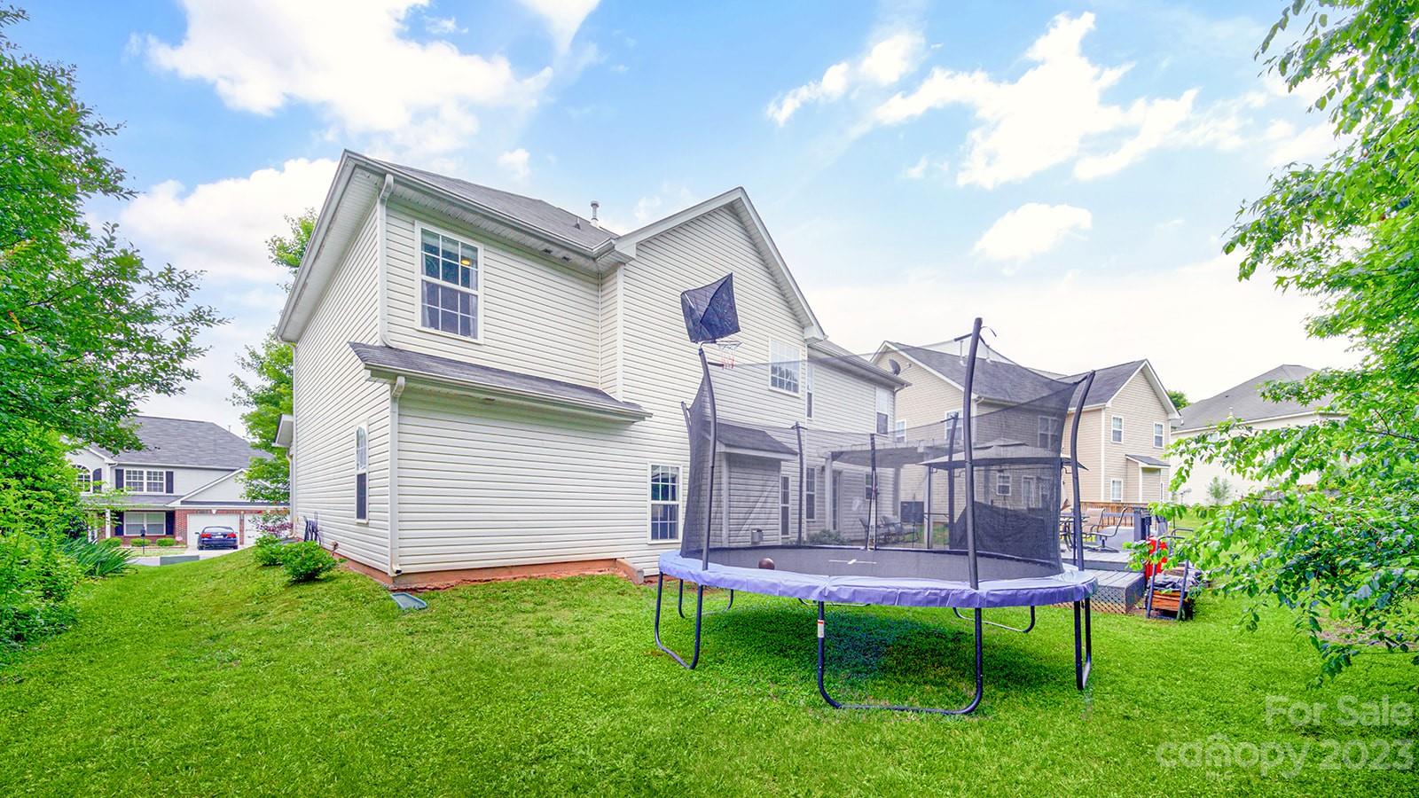 5207 Sunriver Road Gastonia, NC 28054 - Photo 44 of 46 a view of a house with a yard and deck