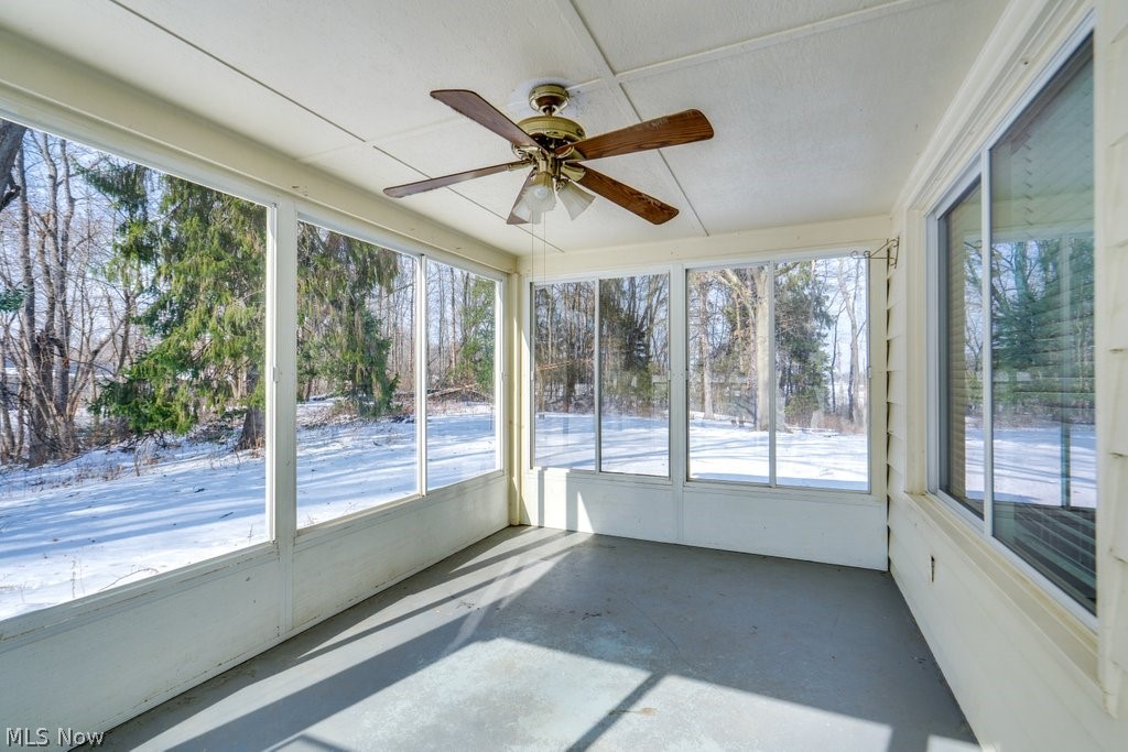 900 State Mill Road Akron, OH 44319 - Photo 31 of 41 Unfurnished sunroom with ceiling fan and healthy amount of natural light