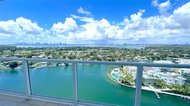 a view of a lake with a city