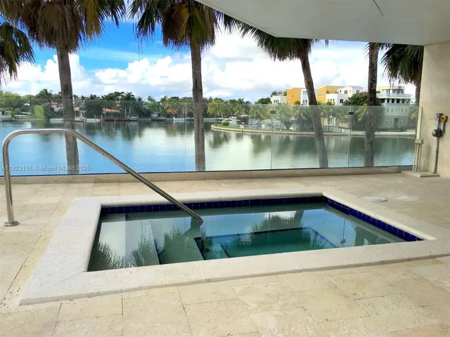 a view of swimming pool with a lake view