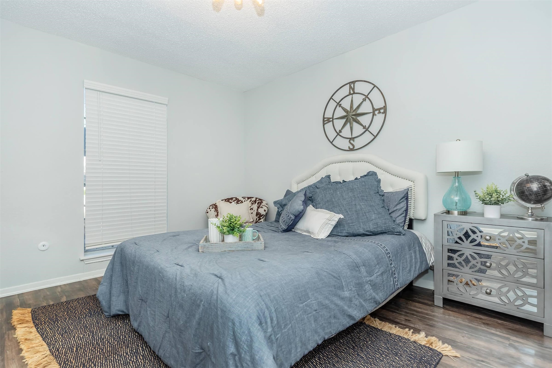 3001 Hillcroft Street, Unit G0608 Houston, TX 77057 - Photo 4 of 50 a bedroom with a bed and wooden floor