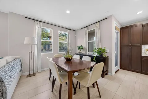 a dining room with furniture and window
