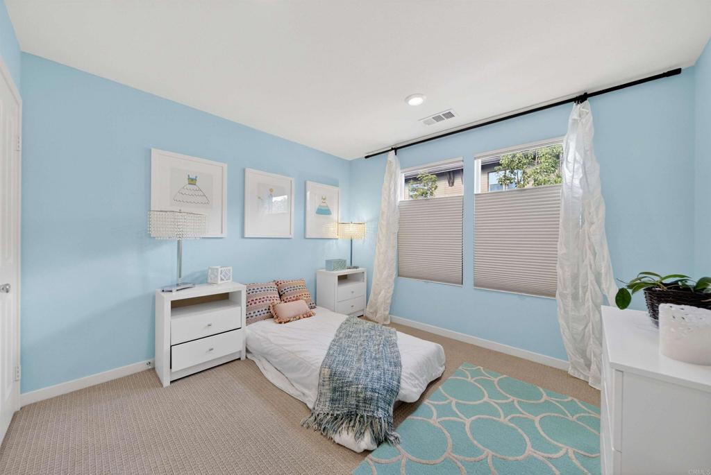 387 Mission Villas Road San Marcos, CA 92069 - Photo 25 of 45 a bedroom with a bed and a lamp on the dresser