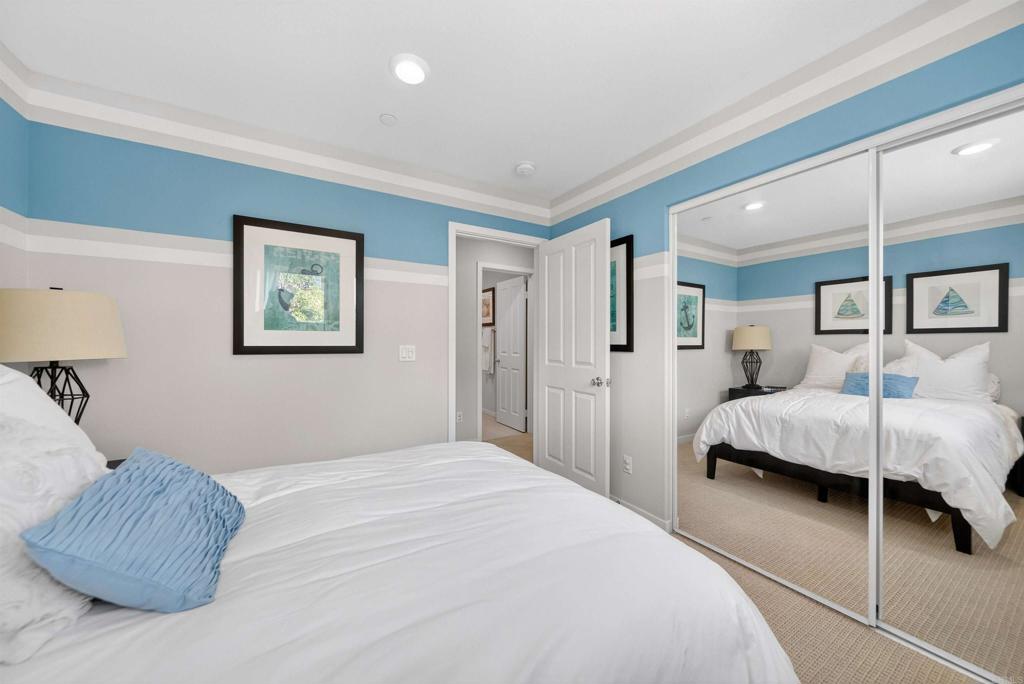 387 Mission Villas Road San Marcos, CA 92069 - Photo 31 of 45 a bedroom with a large bed and a walk in closet