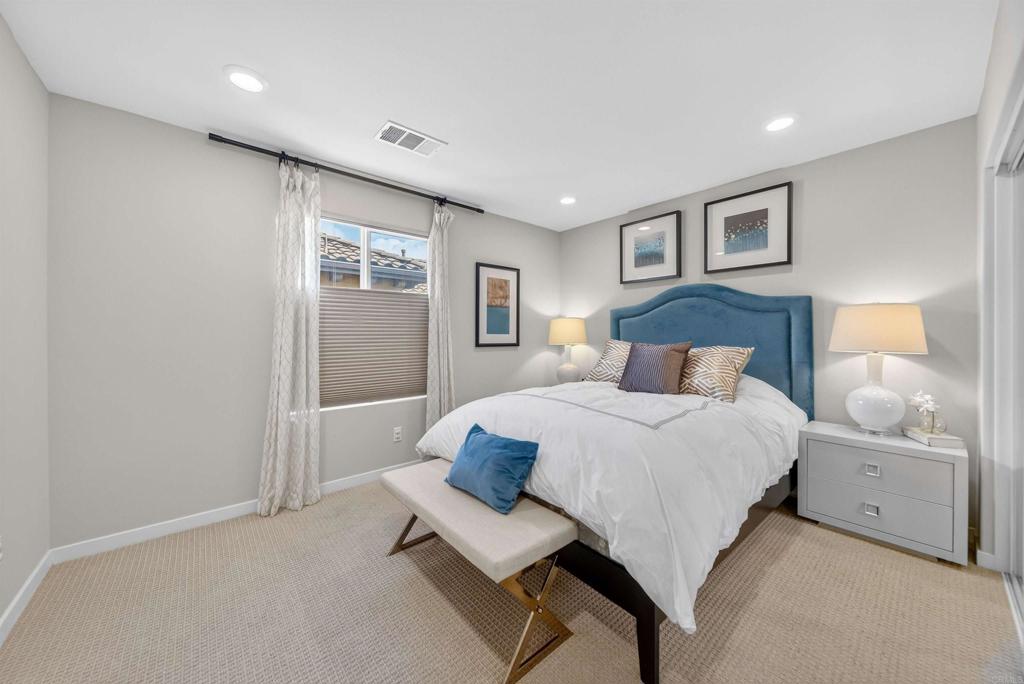 387 Mission Villas Road San Marcos, CA 92069 - Photo 33 of 45 a bedroom with a large bed and a window