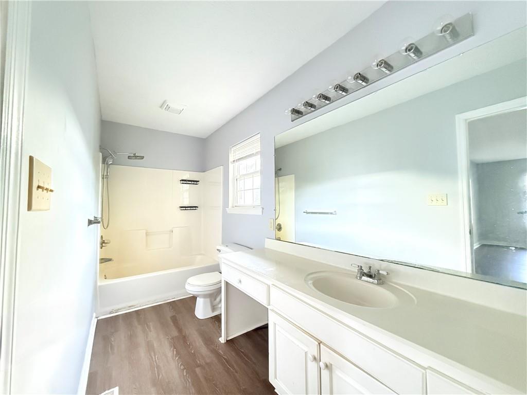 330 Peach Orchard Road Baldwin, GA 30531 - Photo 13 of 13 a bathroom with a sink a toilet and a large mirror