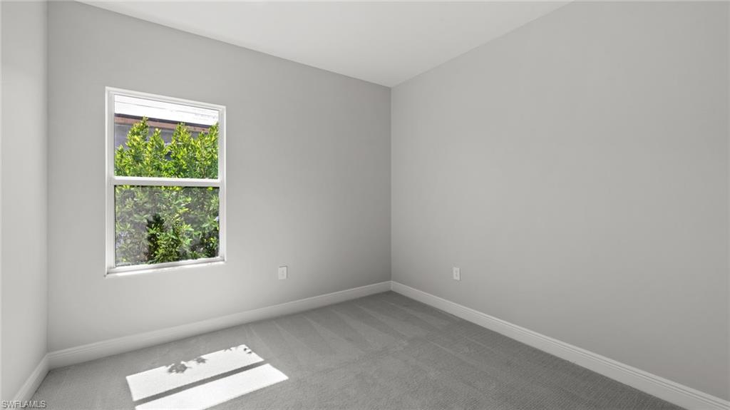 4641 Centaurus Circle Naples, FL 34120 - Photo 15 of 31 an empty room with a window