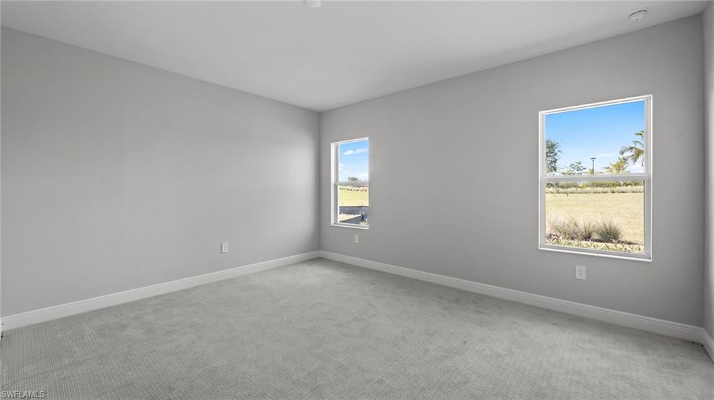 4641 Centaurus Circle Naples, FL 34120 - Photo 23 of 31 an empty room with windows