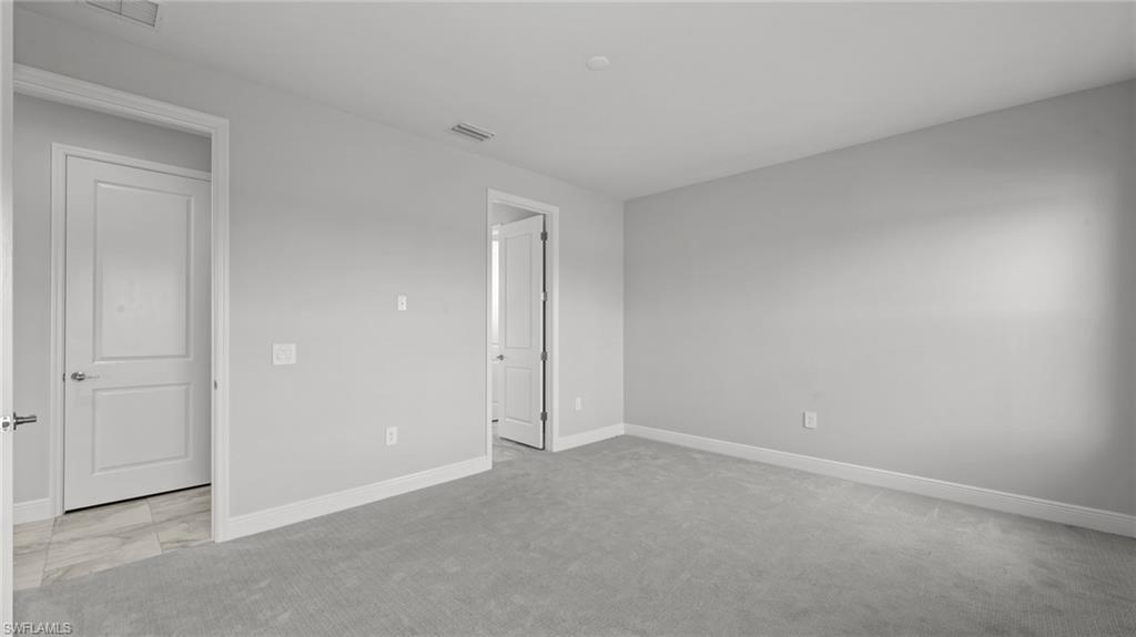 4641 Centaurus Circle Naples, FL 34120 - Photo 24 of 31 a view of an empty room