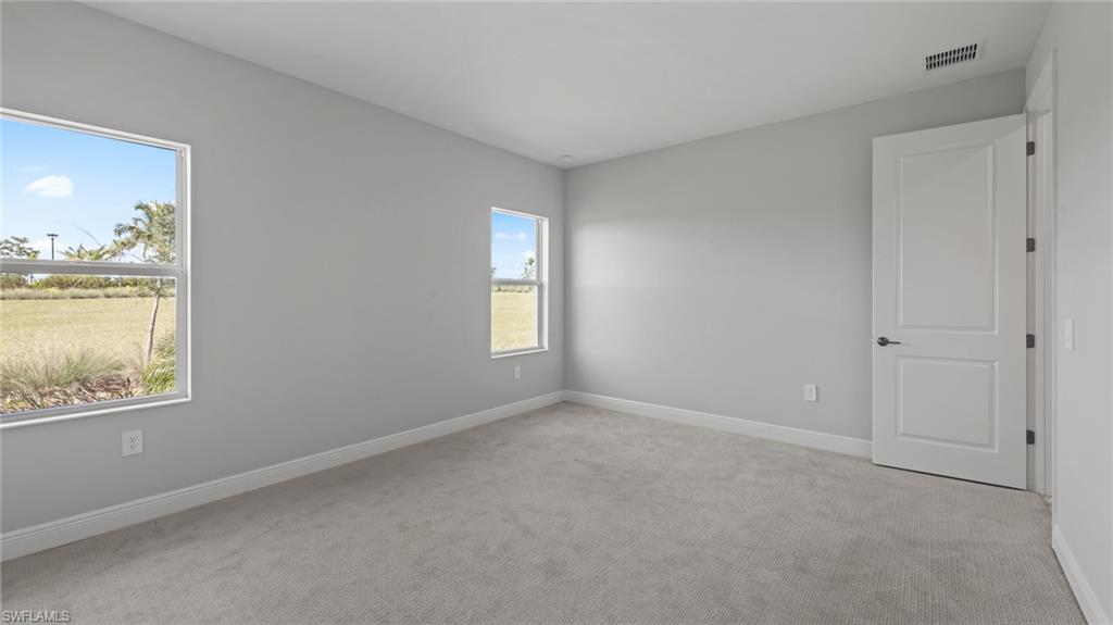 4641 Centaurus Circle Naples, FL 34120 - Photo 25 of 31 a view of an empty room with a window