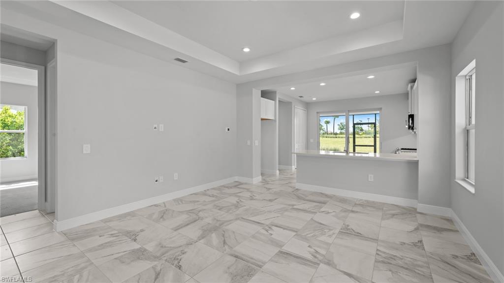 4641 Centaurus Circle Naples, FL 34120 - Photo 5 of 31 a view of an empty room with a window