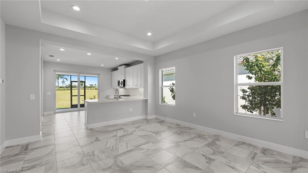 4641 Centaurus Circle Naples, FL 34120 - Photo 6 of 31 a view of an empty room with a window