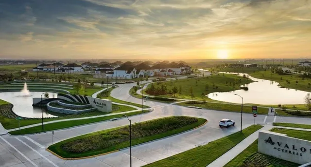 a view of a swimming pool with a patio and a garden