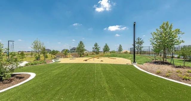 a view of a swimming pool and outdoor kitchen