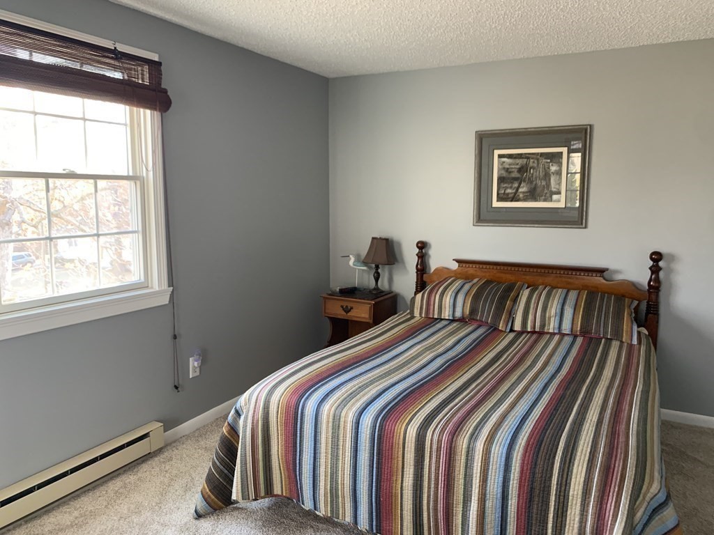 70 Driftwood Road Springfield, MA 01128 - Photo 13 of 25 a bedroom with bed and a window