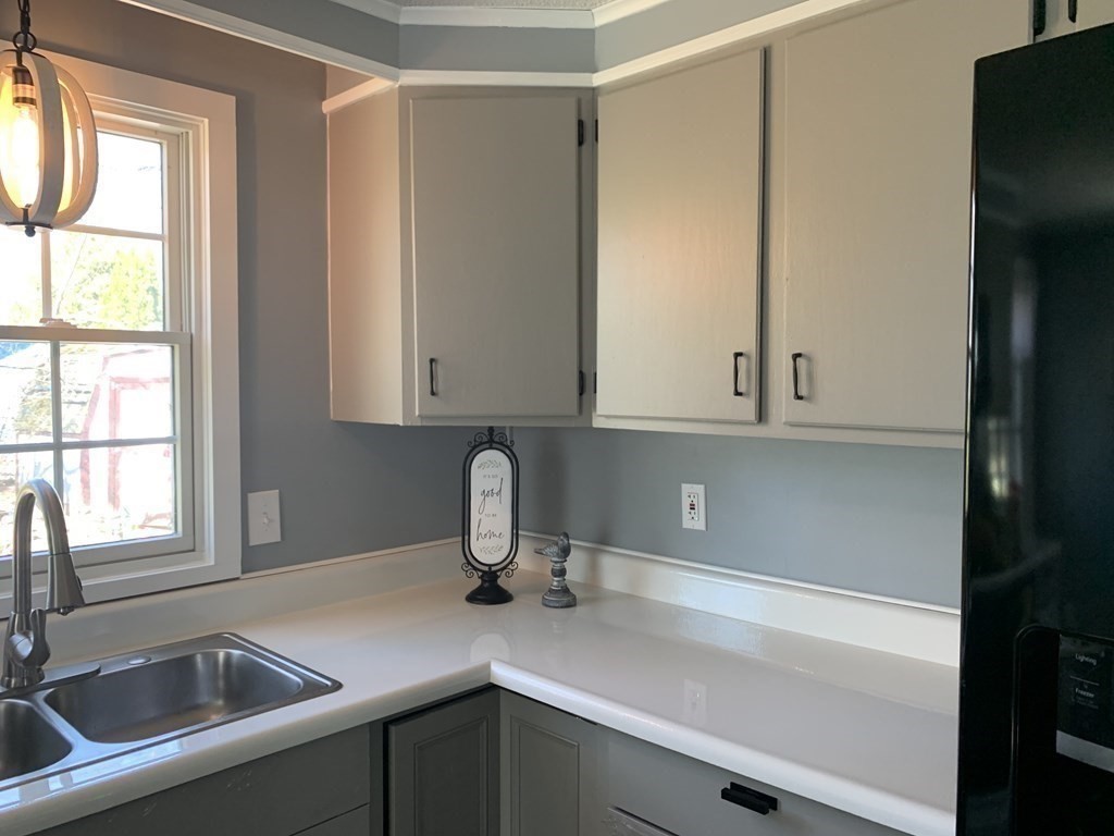 70 Driftwood Road Springfield, MA 01128 - Photo 7 of 25 a kitchen with a sink and cabinets