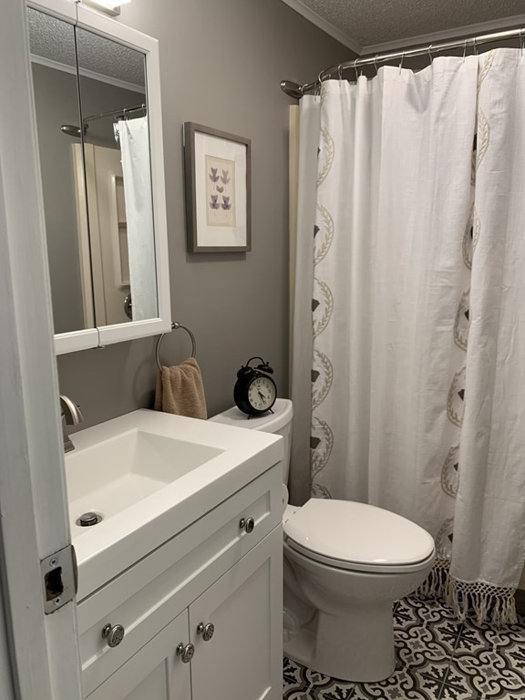 70 Driftwood Road Springfield, MA 01128 - Photo 8 of 25 a bathroom with a sink toilet and shower