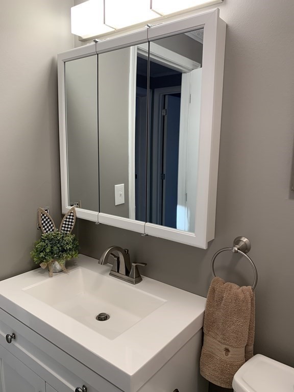 70 Driftwood Road Springfield, MA 01128 - Photo 9 of 25 a bathroom with a sink and a mirror
