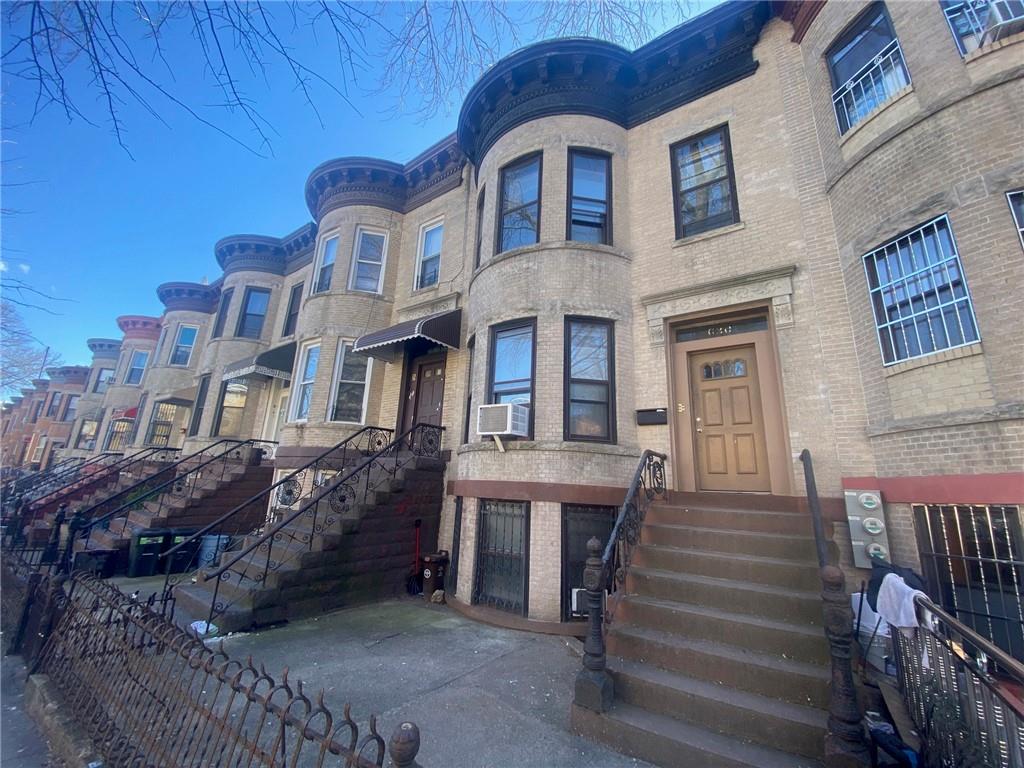 630 53rd Street Brooklyn, NY 11220 - Photo 2 of 14 a front view of a house with a garden