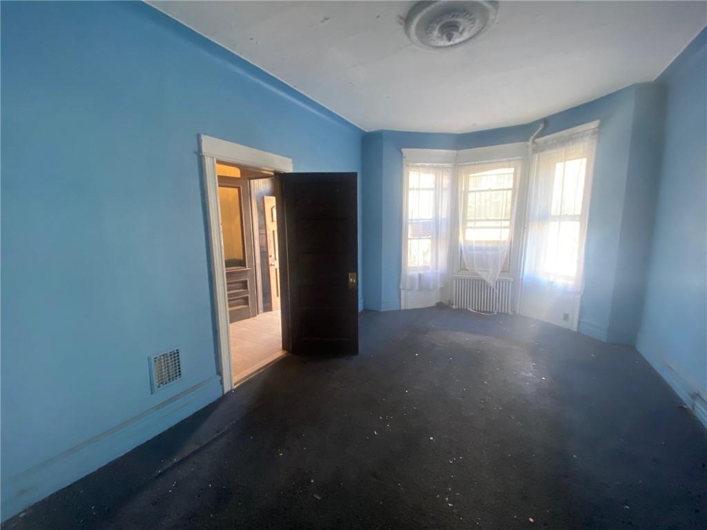 630 53rd Street Brooklyn, NY 11220 - Photo 6 of 14 an empty room that has a window