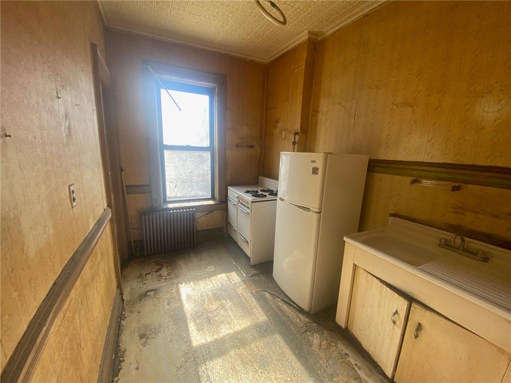 630 53rd Street Brooklyn, NY 11220 - Photo 9 of 14 a utility room with dryer and washer