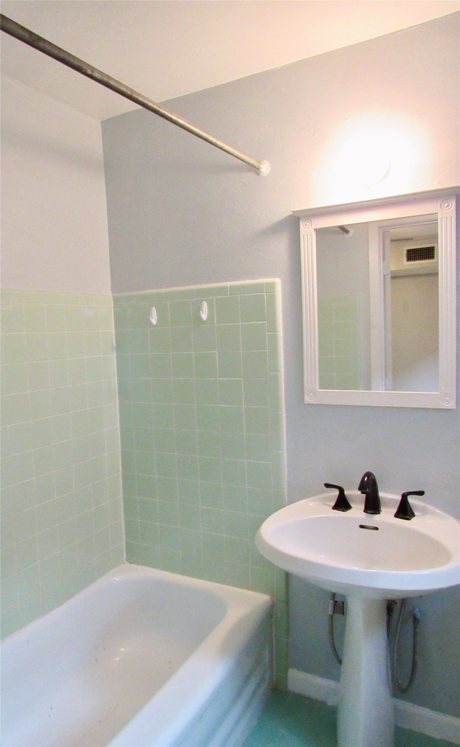 907 Heights Boulevard Houston, TX 77008 - Photo 8 of 10 a bathroom with a sink a toilet and shower