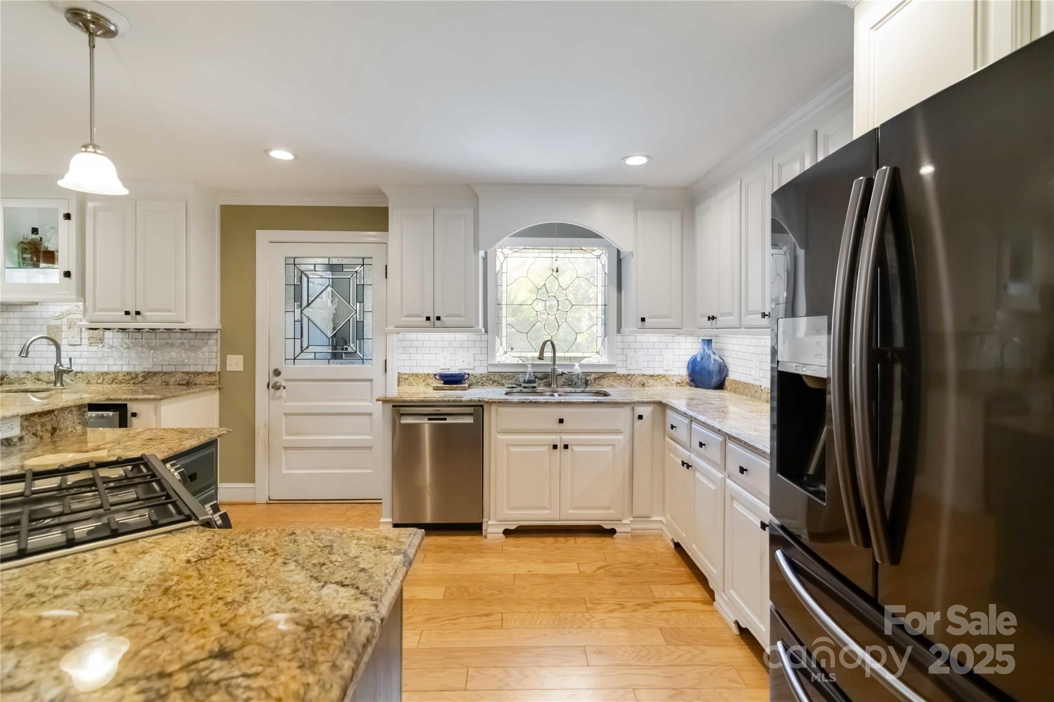 2880 Legion Road Smyrna, SC 29743 - Photo 12 of 48 a kitchen with a sink stove and refrigerator
