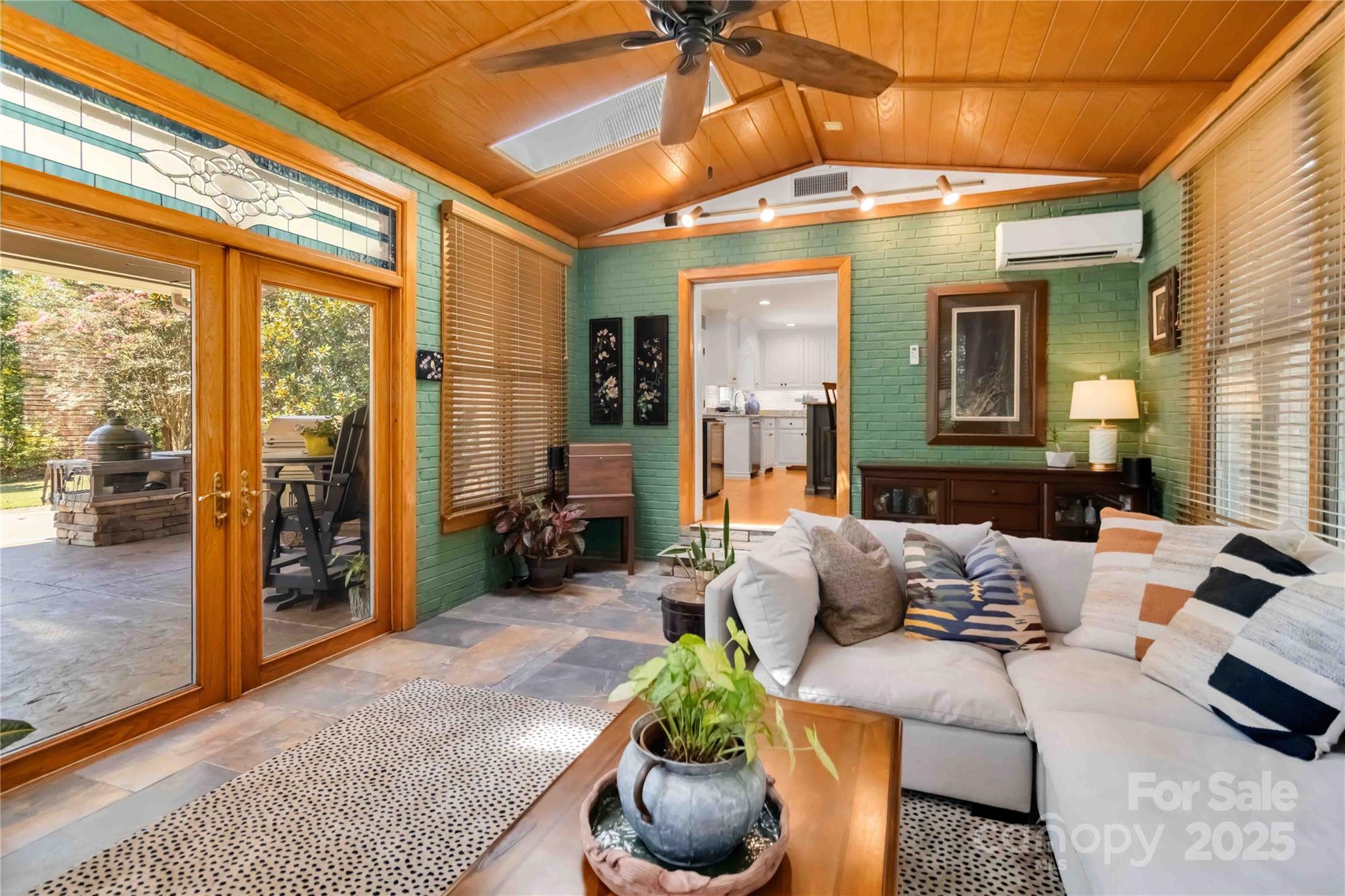 2880 Legion Road Smyrna, SC 29743 - Photo 22 of 48 a living room with furniture and a floor to ceiling window