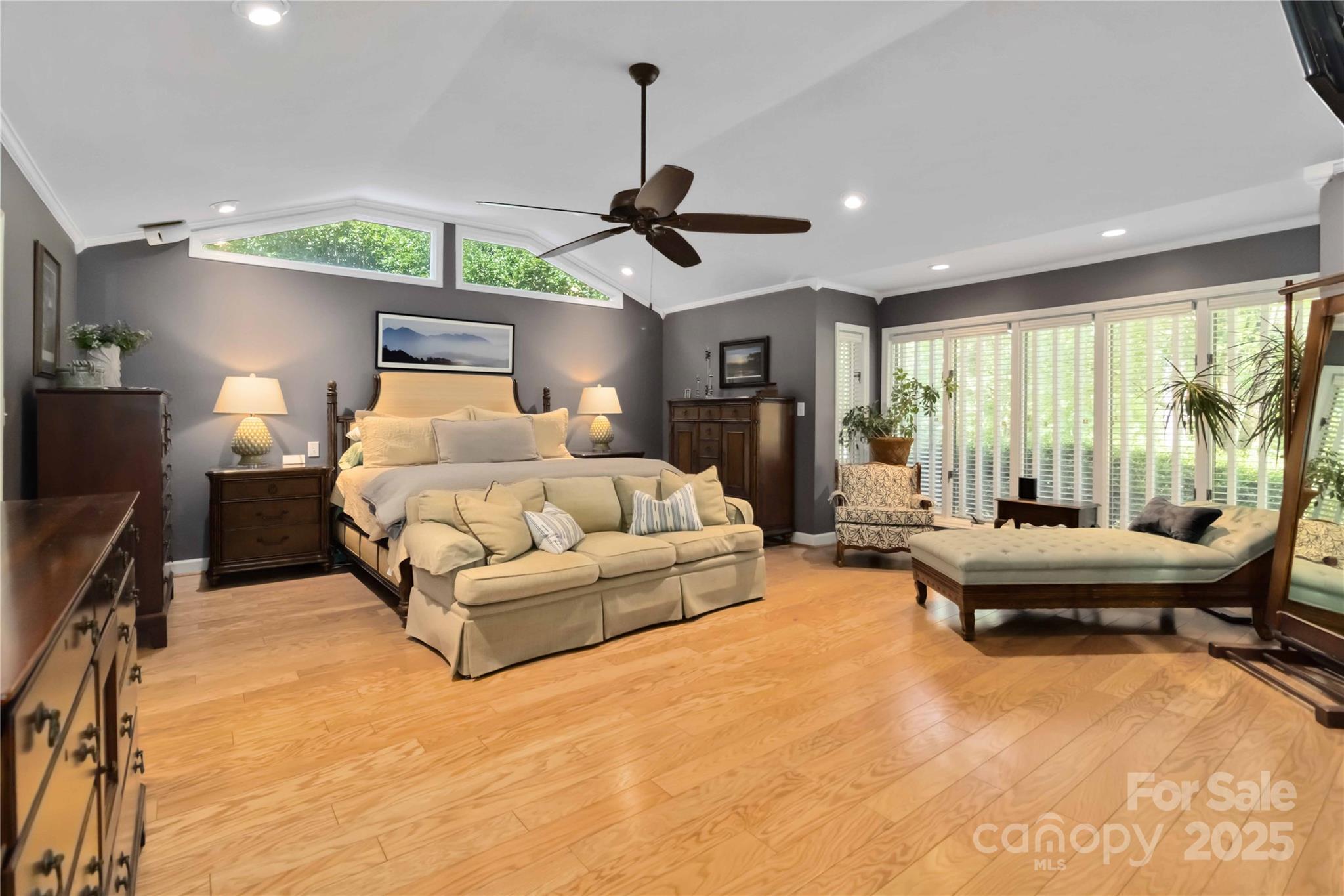 2880 Legion Road Smyrna, SC 29743 - Photo 29 of 48 a living room with furniture a fireplace and a chandelier