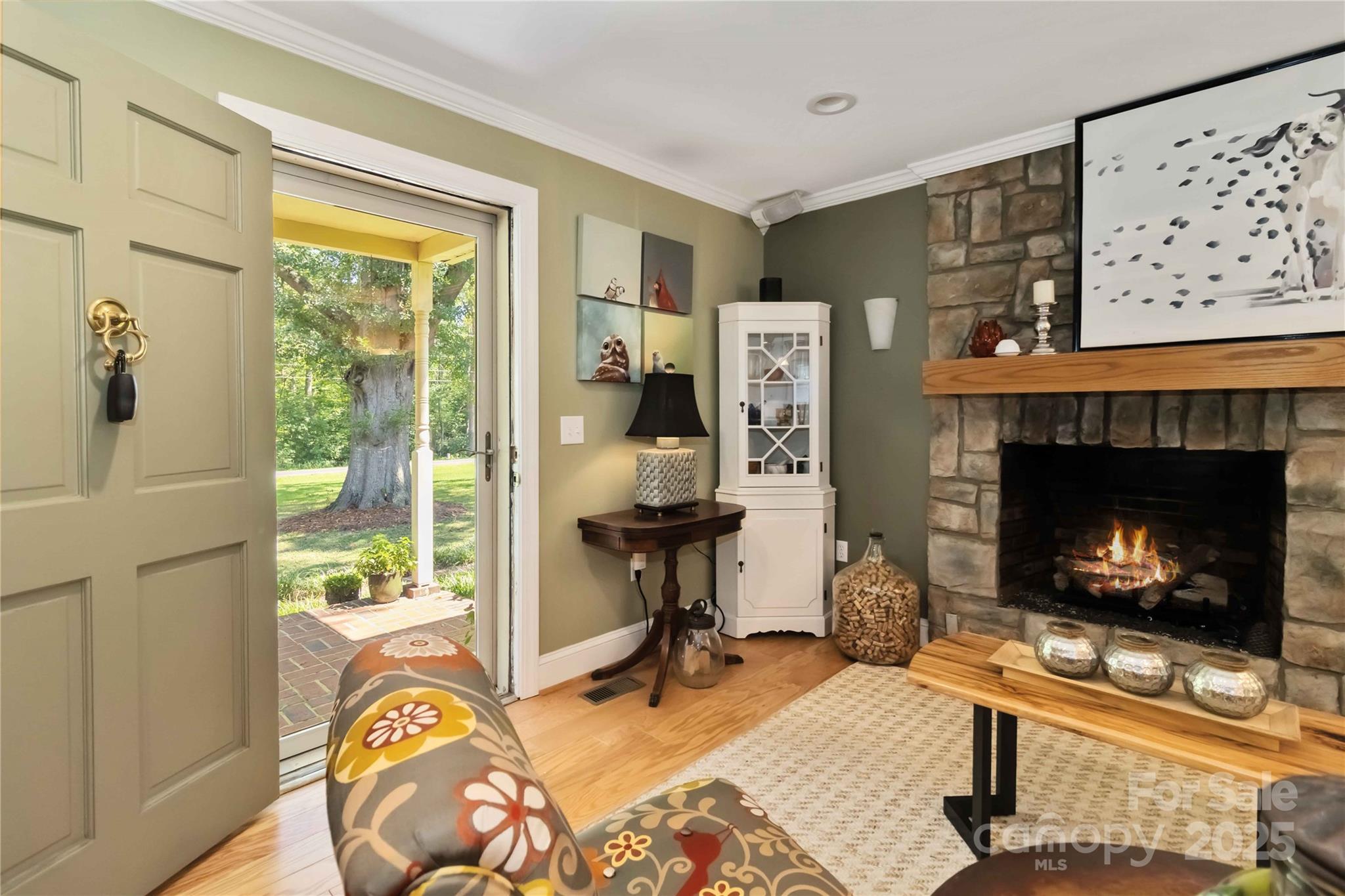 2880 Legion Road Smyrna, SC 29743 - Photo 3 of 48 a living room with furniture a fireplace and a table