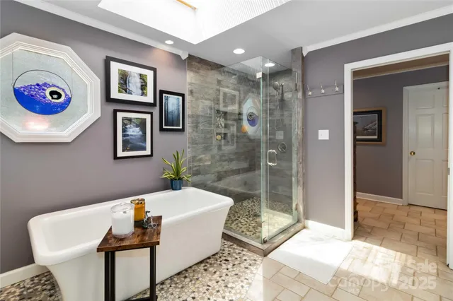 a bathroom with a tub a toilet and a shower