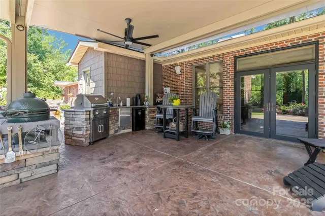 a view of a room with furniture and floor to ceiling window